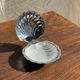 Vintage silver-plated shell butter dish with transparent bowl.