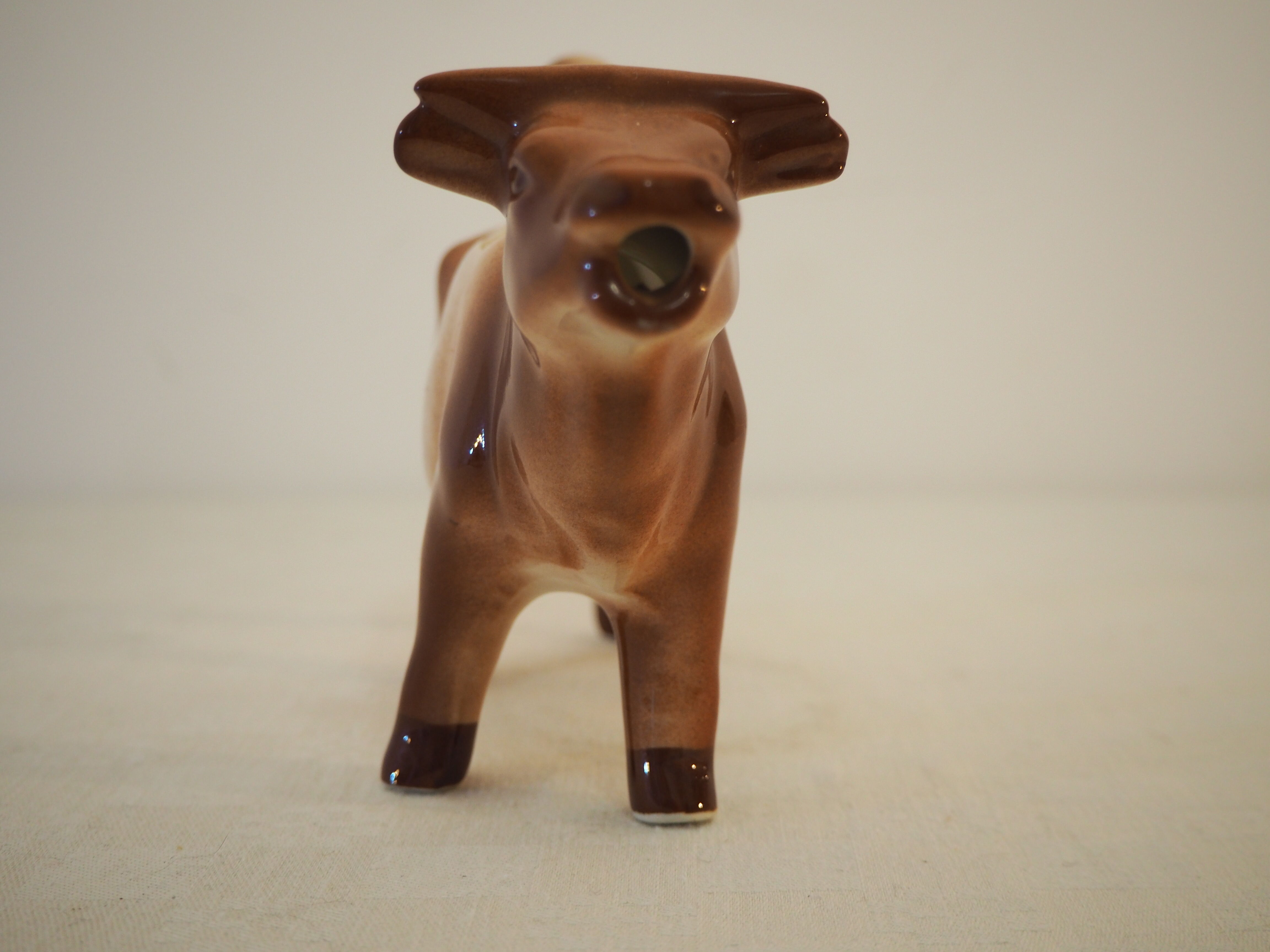 Milk jar in the shape of a vintage ceramic cow