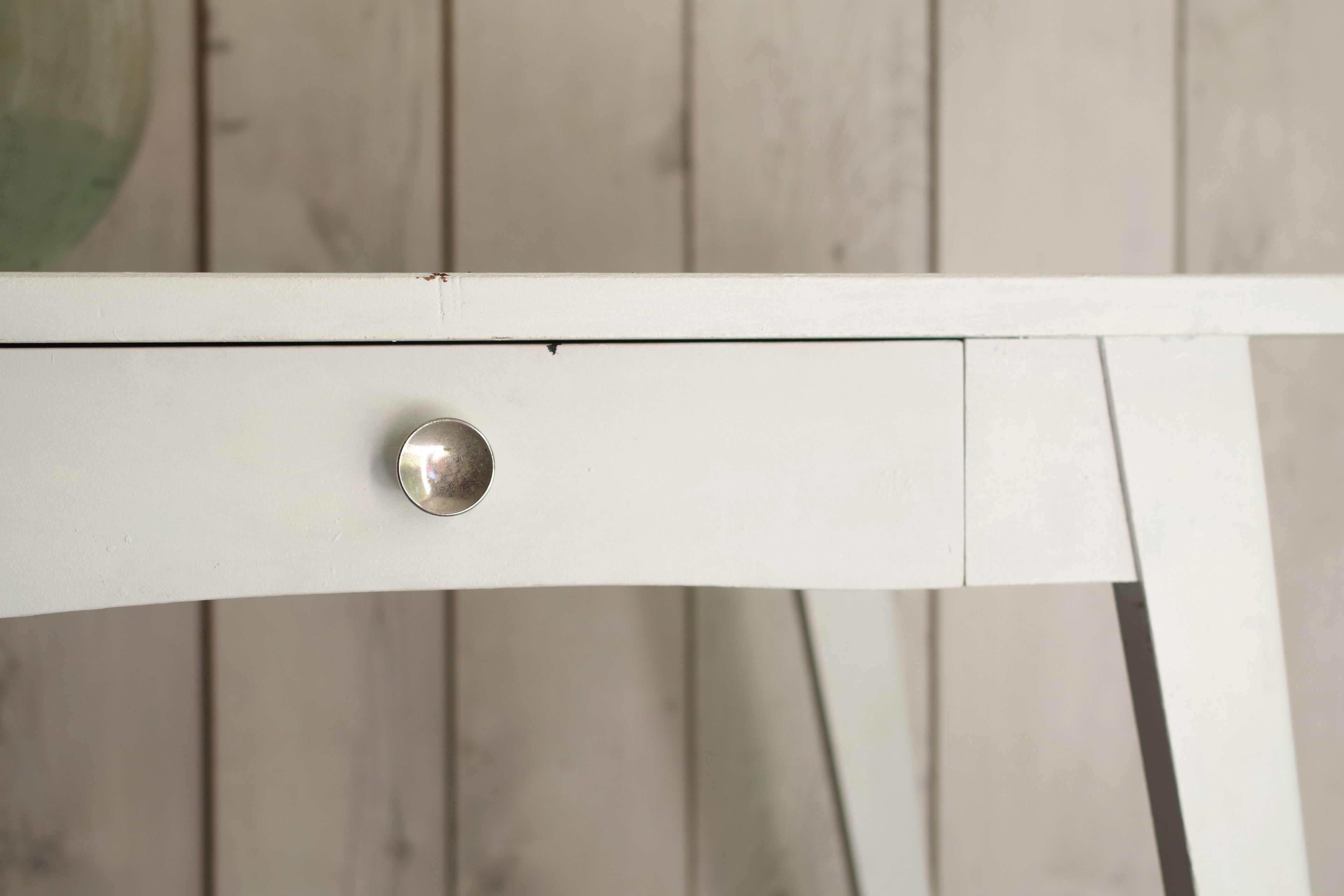 White compass feet table