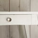 White compass feet table