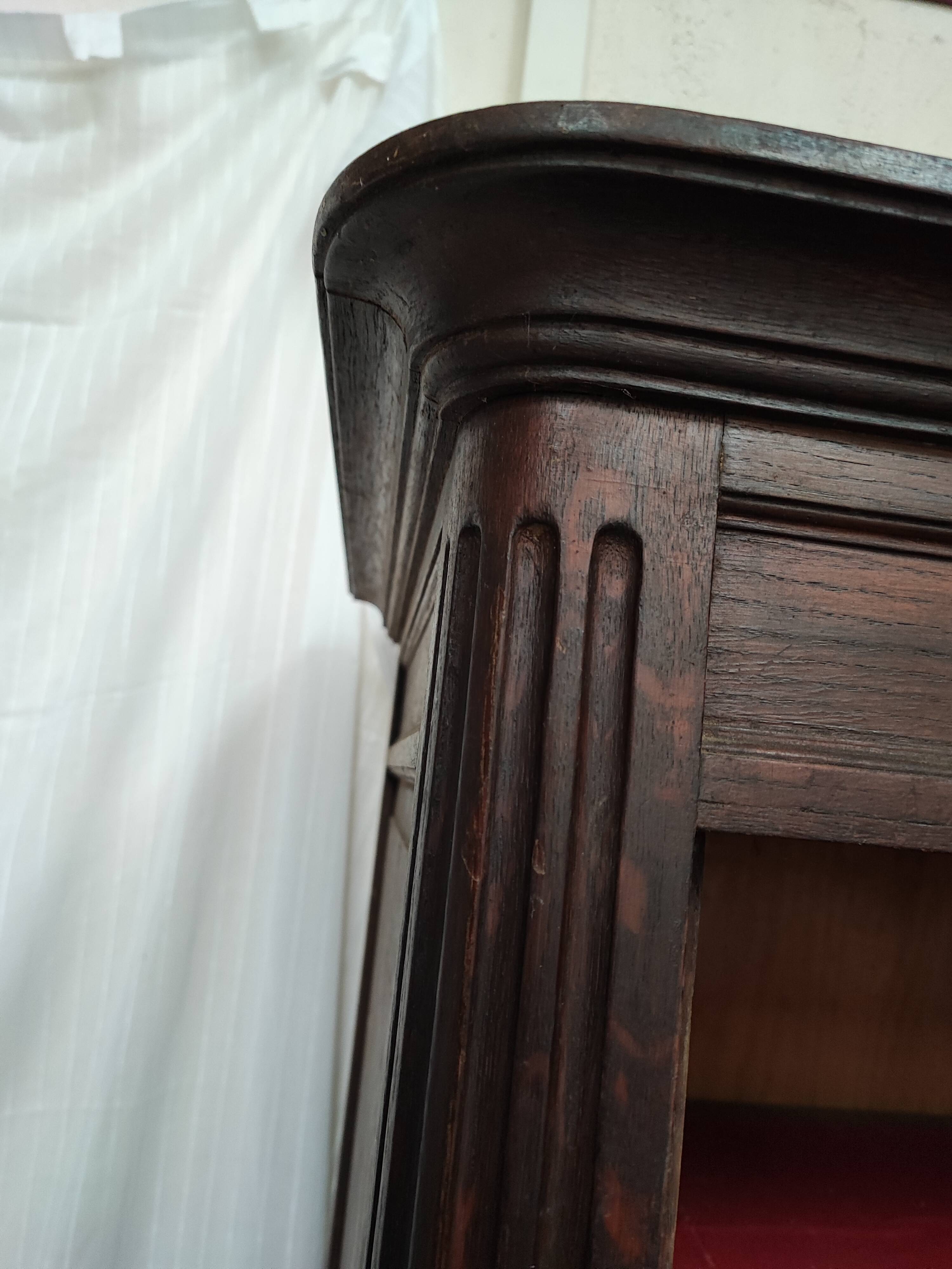 Bonnetière man standing cabinet a door