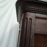 Bonnetière man standing cabinet a door