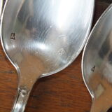 15 small silver metal spoons with rows of beads