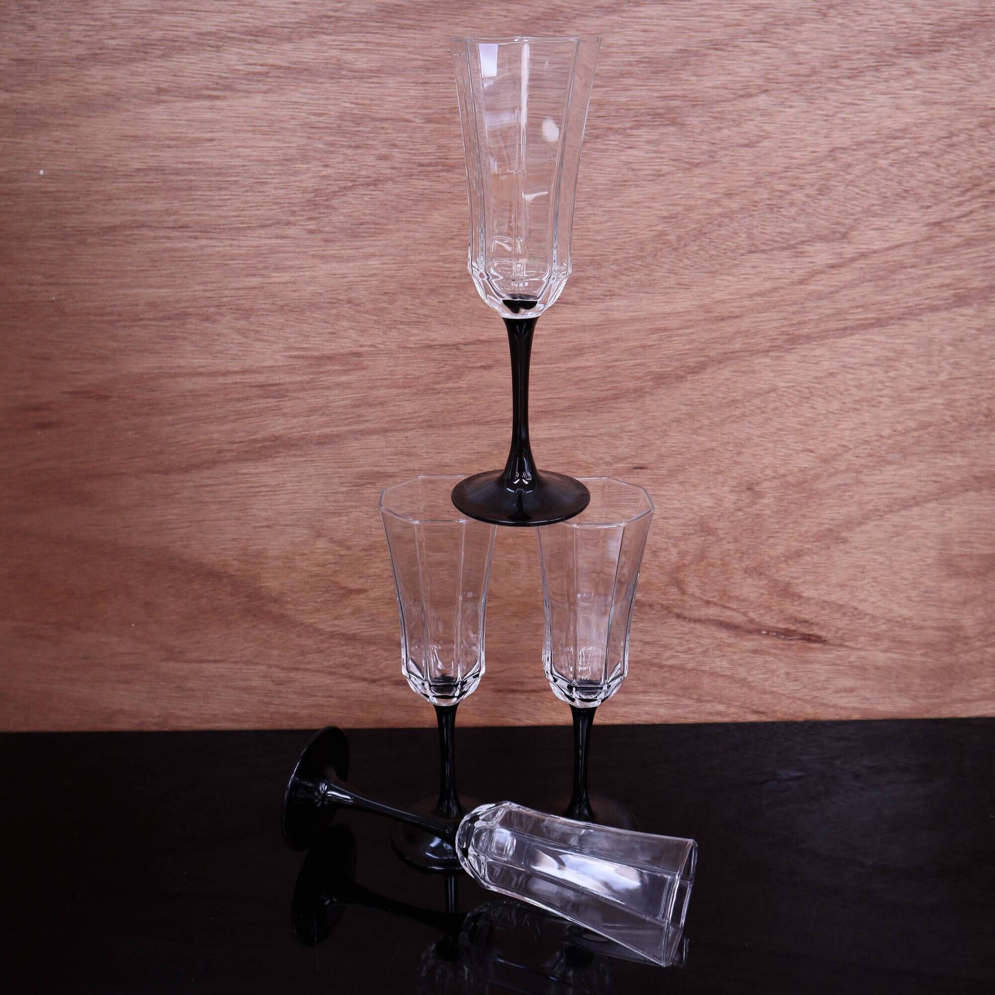 4 octagonal black base Champagne flutes Octime