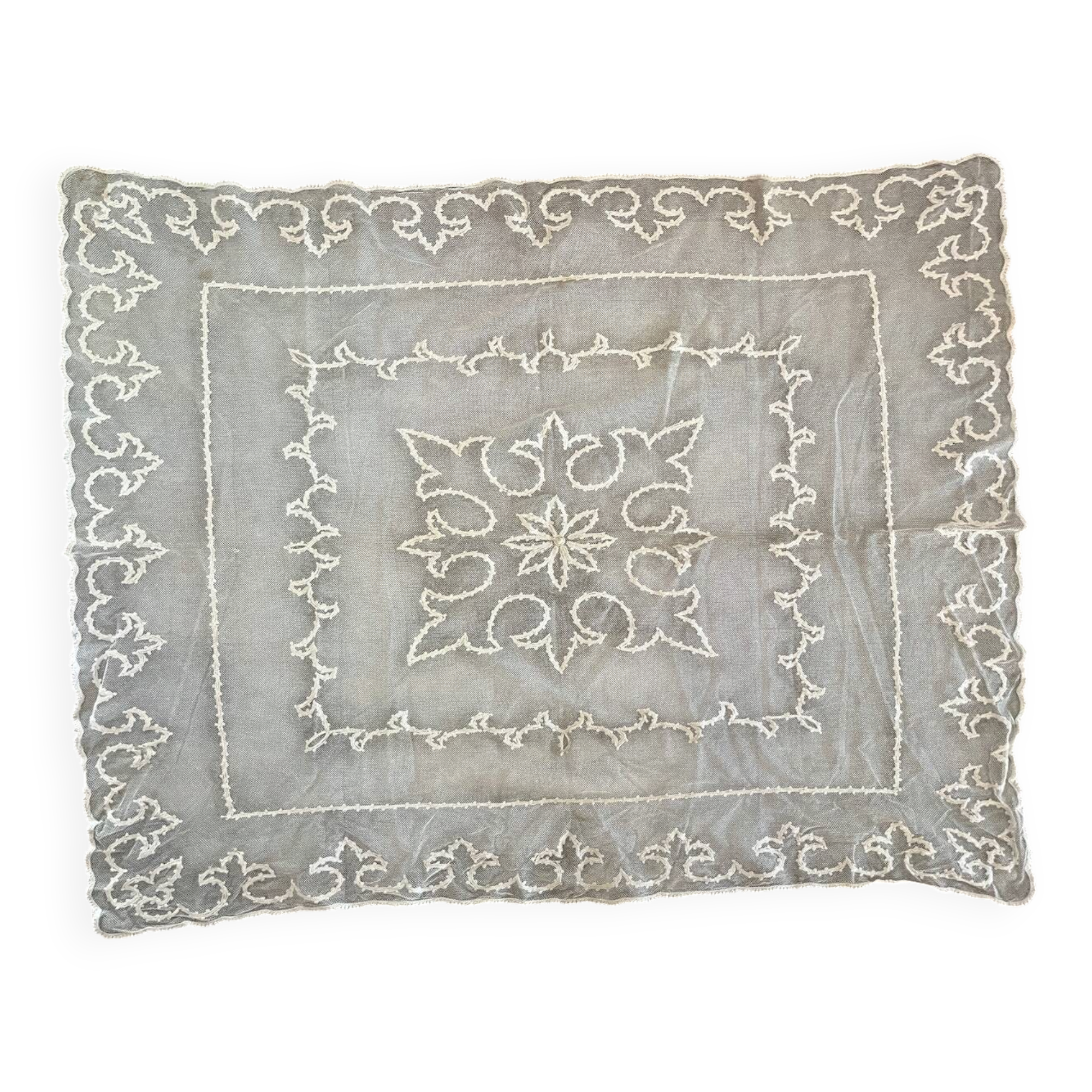 Old tablecloth embroidered with openwork embroidery.