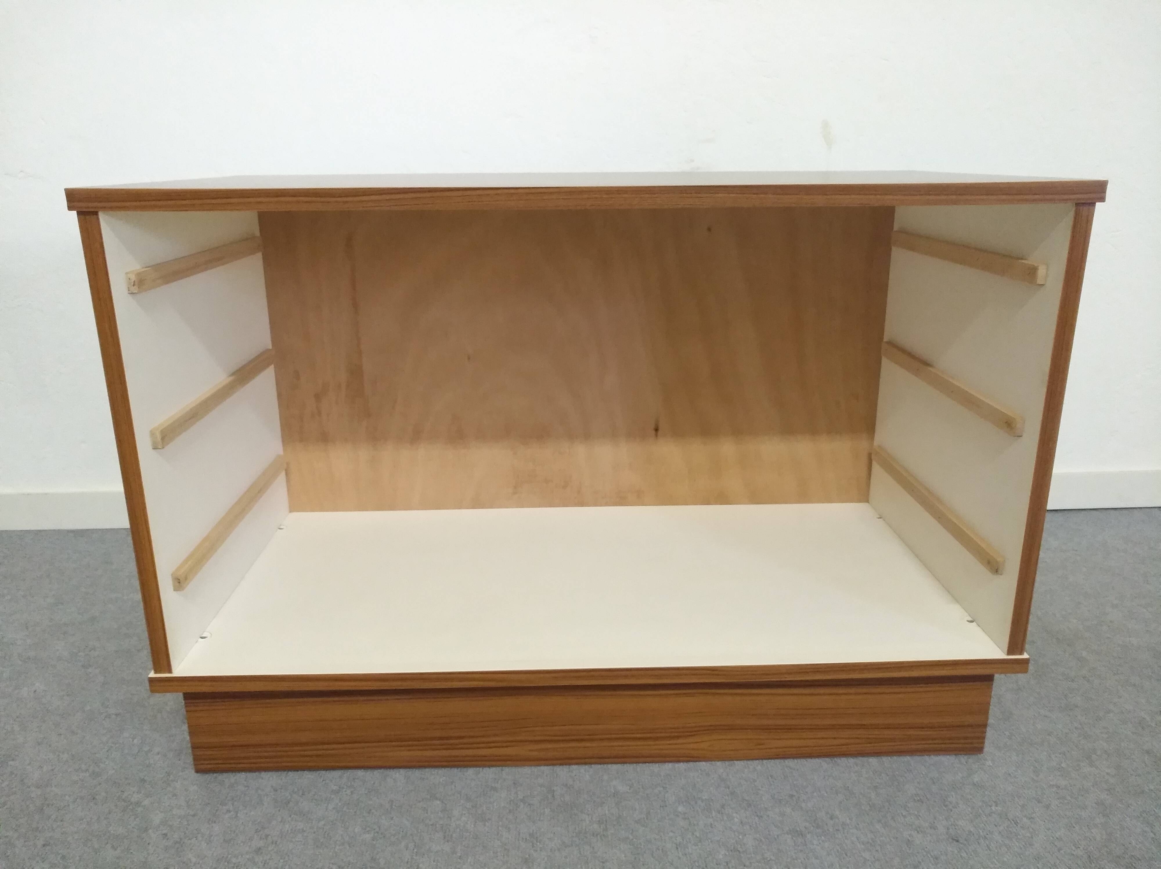Low chest of drawers with 3 drawers in mahogany and white satin, France circa 1980.