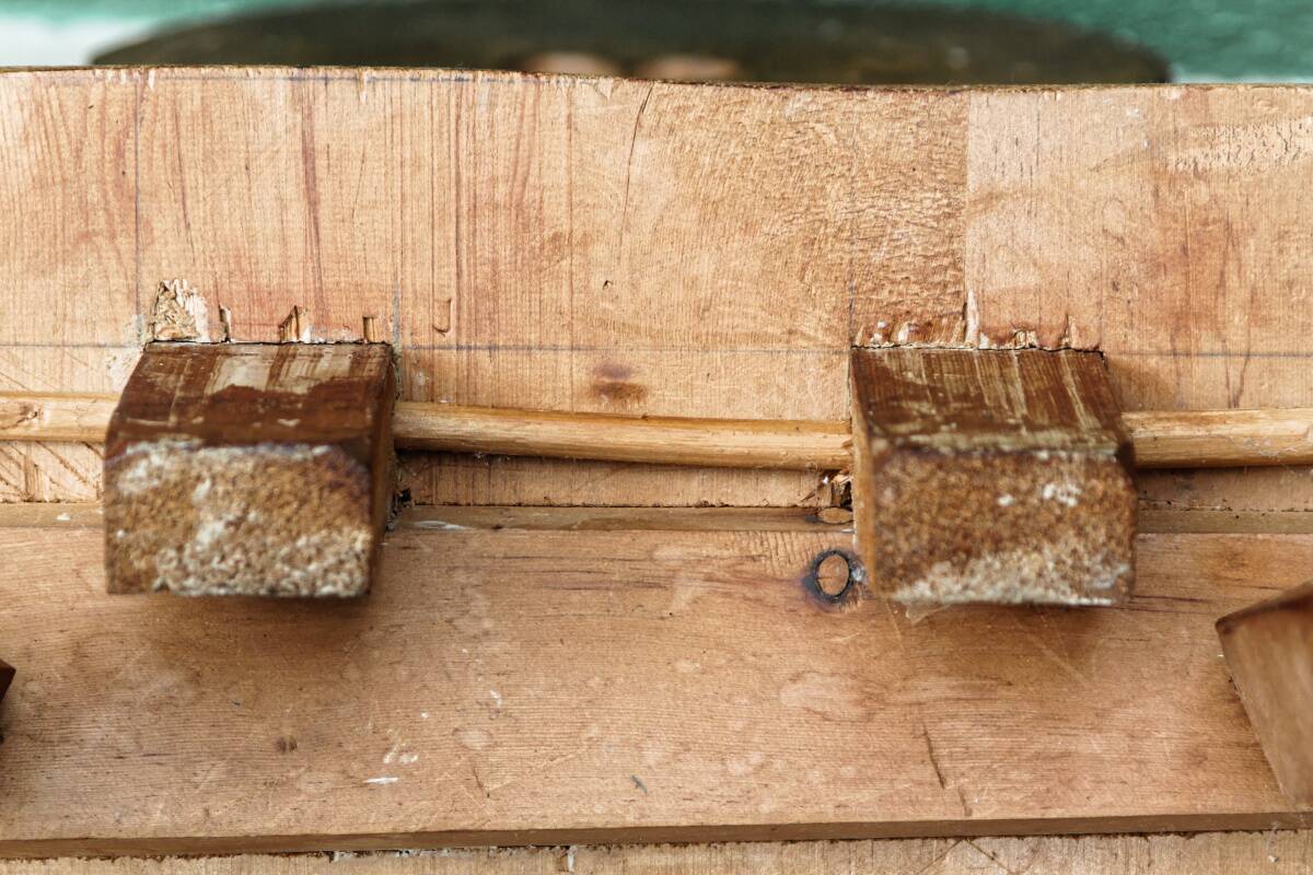 Old Swiss escabelle chair in carved wood