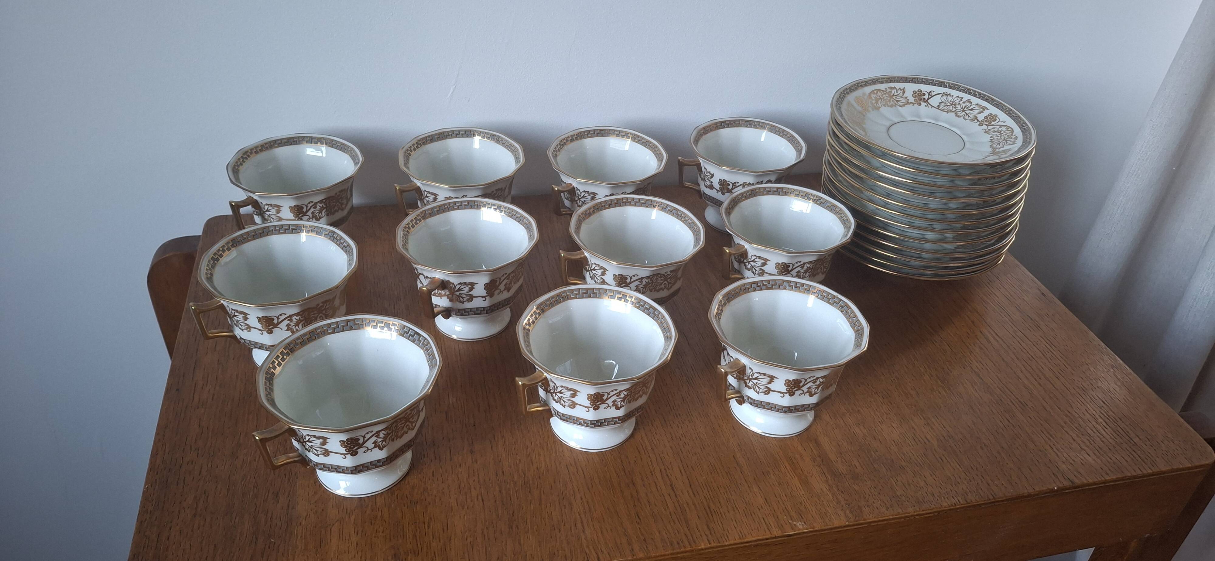 Set of 11 cups and saucers