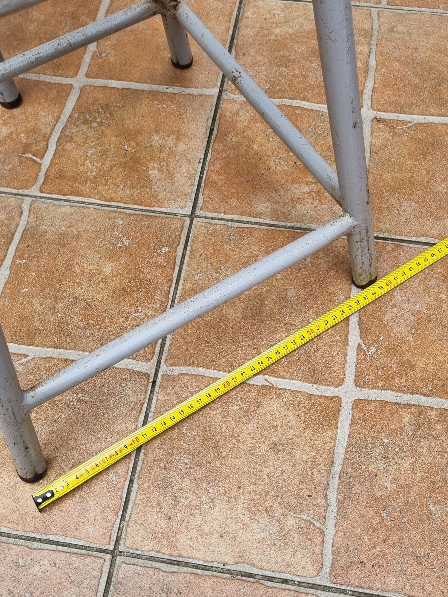 Set of four stackable industrial tubular metal and wood stools