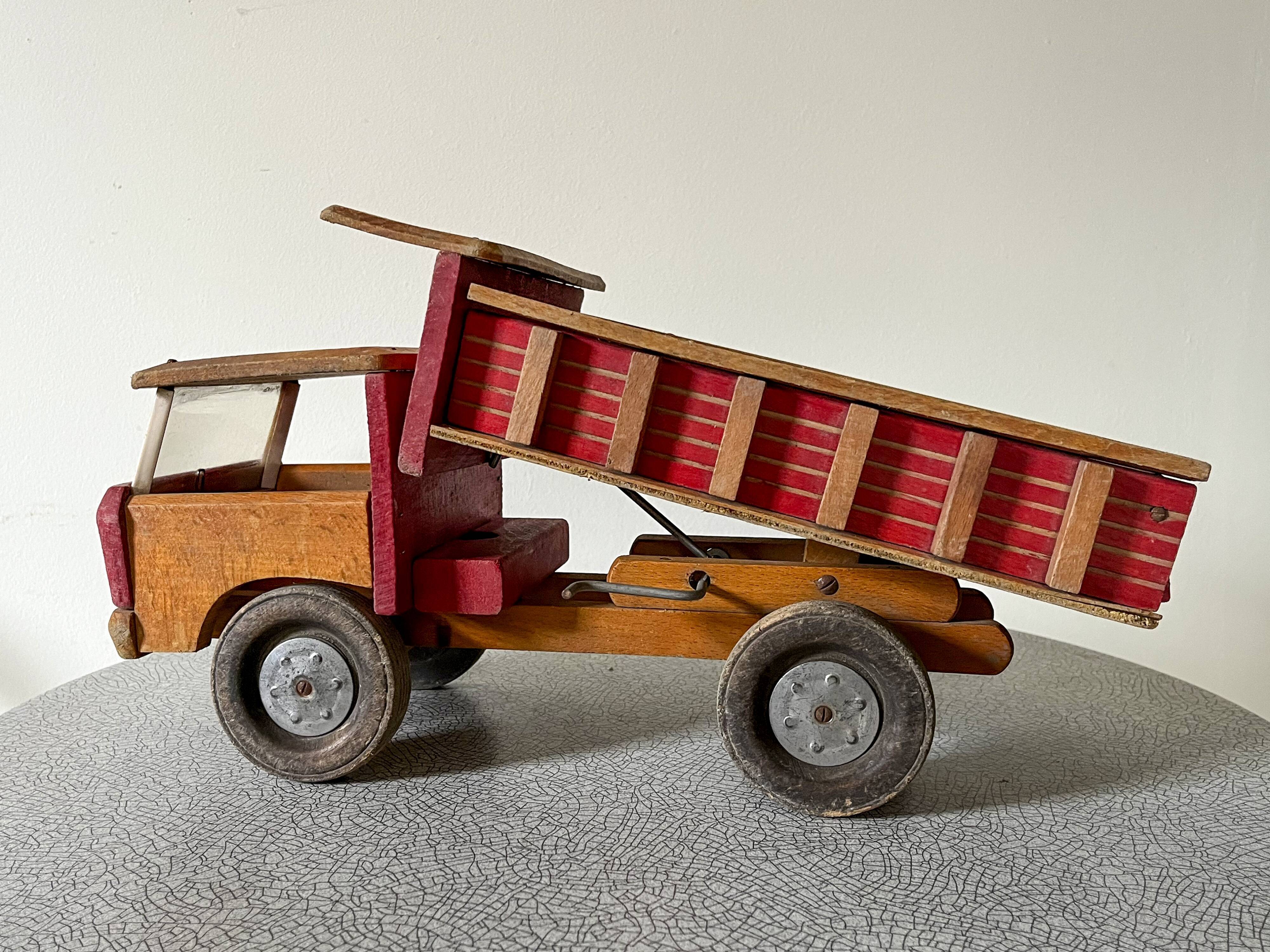 Wooden dump truck from the famous french brand dejou