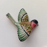 Two exotic birds in slip to hang