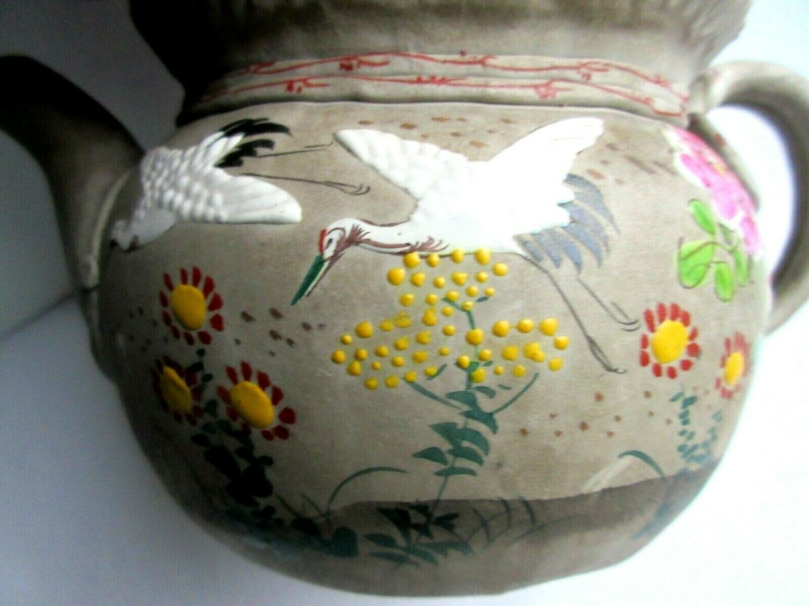 Japanese Art Deco teapot in porcelain biscuit enamelled with cranes and flowers