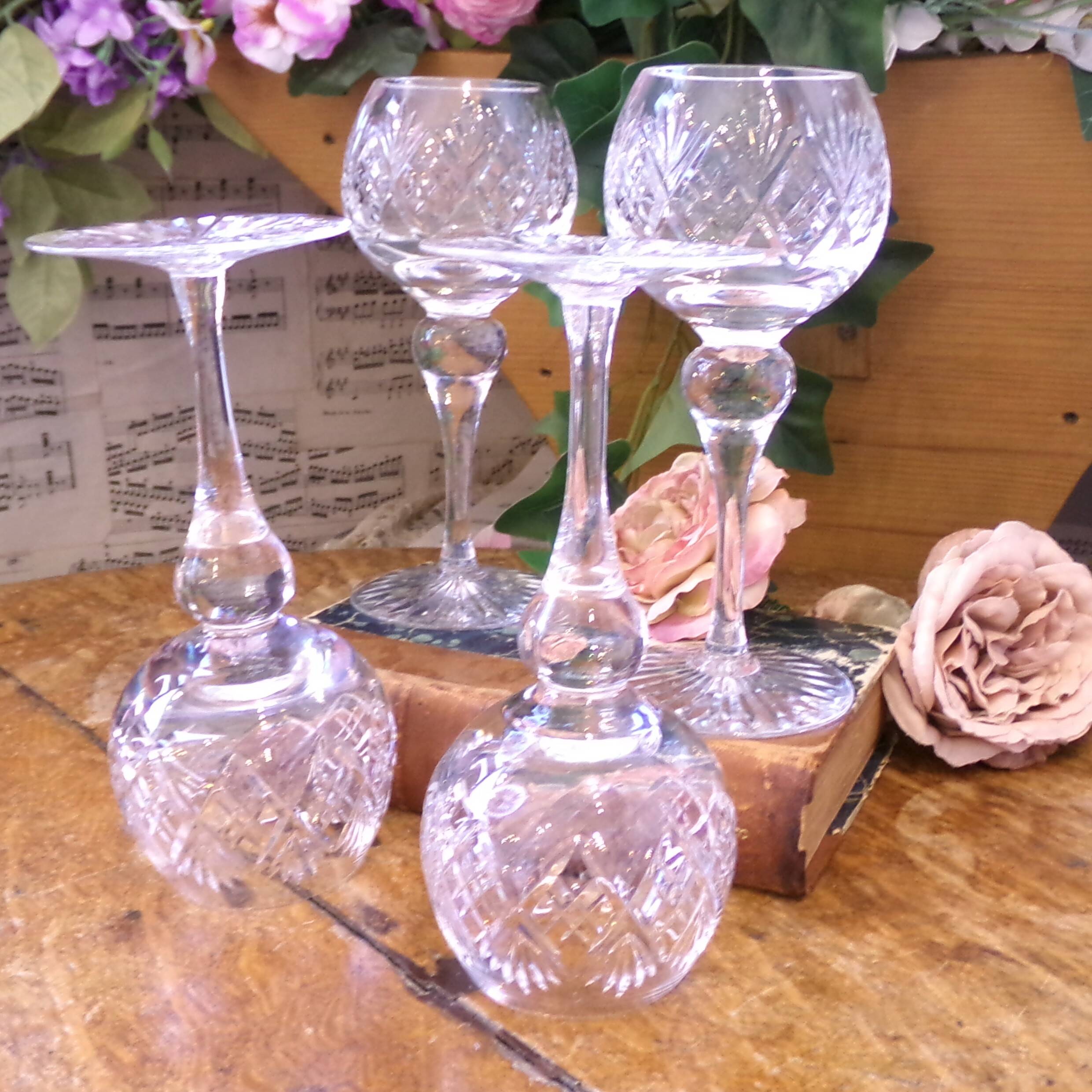 4 lead crystal wine glasses with slender baluster stems.