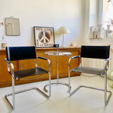 Pair of vintage chrome and black faux leather armchairs