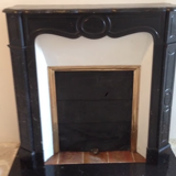 Pompadour fireplace in black marble nineteenth century.