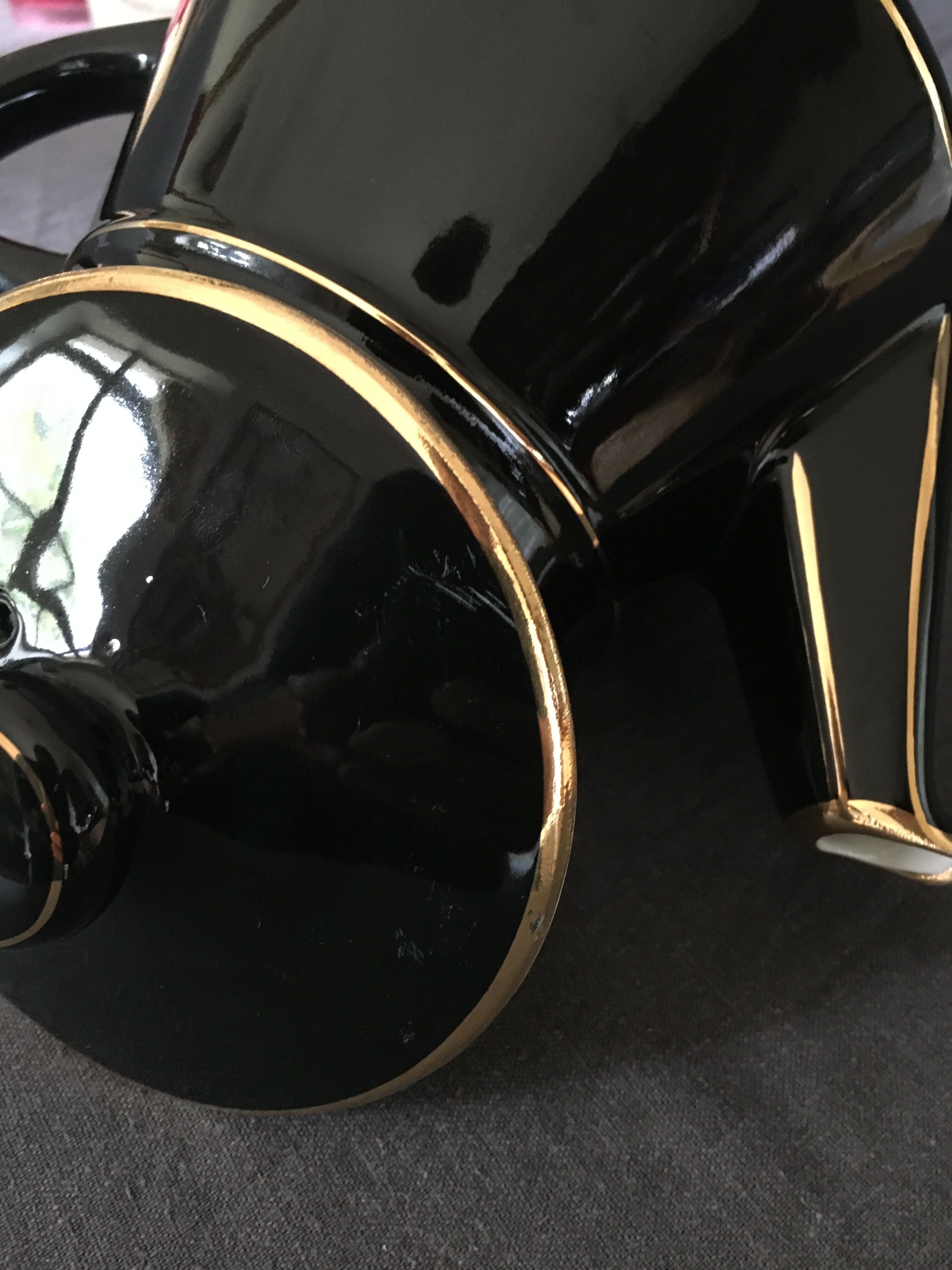 Black and gold ceramic coffee maker