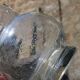 Vintage blown glass pitcher with bubbles, transparent.