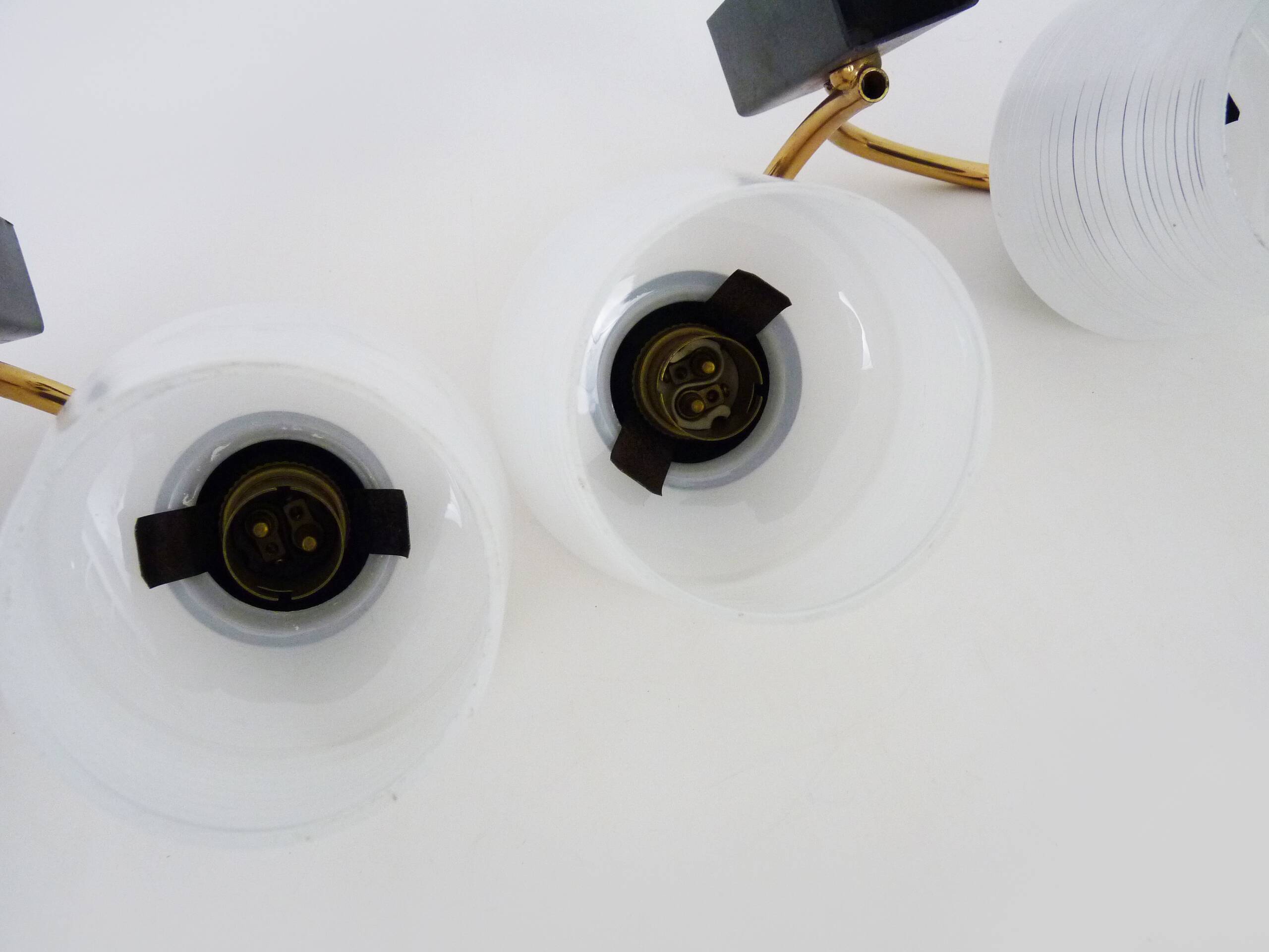 Pair of vintage Maison Arlus wall lights from the 1950s in brass, glass globe.