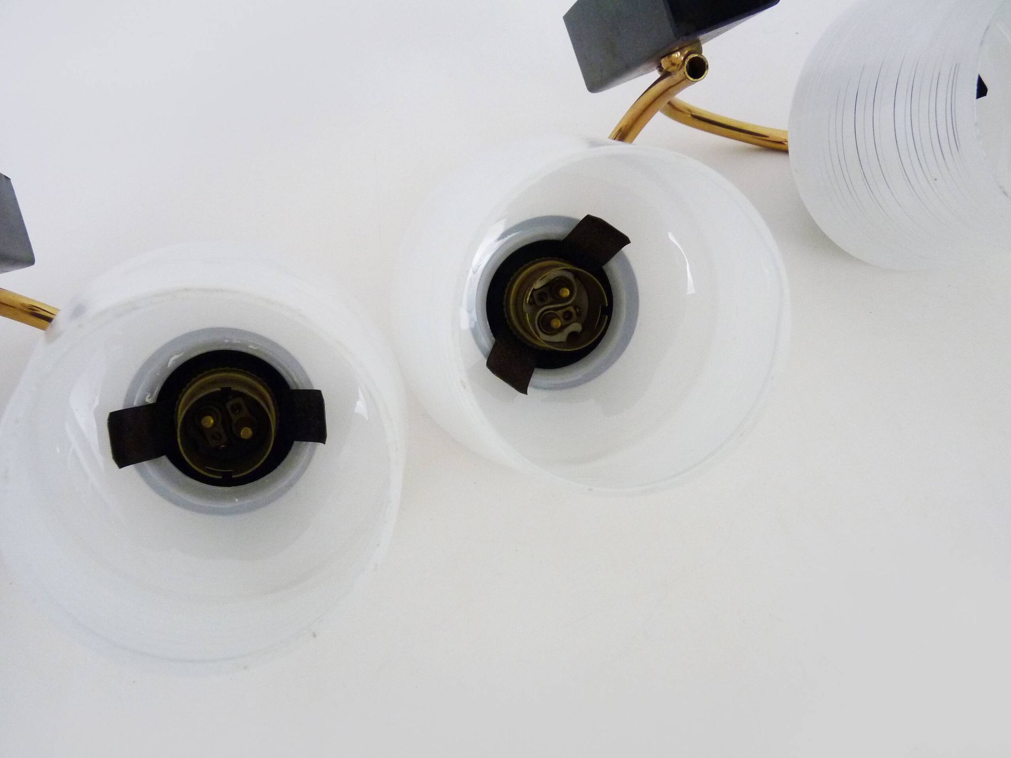 Pair of vintage Maison Arlus wall lights from the 1950s in brass, glass globe.