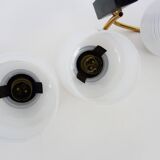 Pair of vintage Maison Arlus wall lights from the 1950s in brass, glass globe.