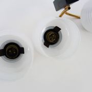 Pair of vintage Maison Arlus wall lights from the 1950s in brass, glass globe.