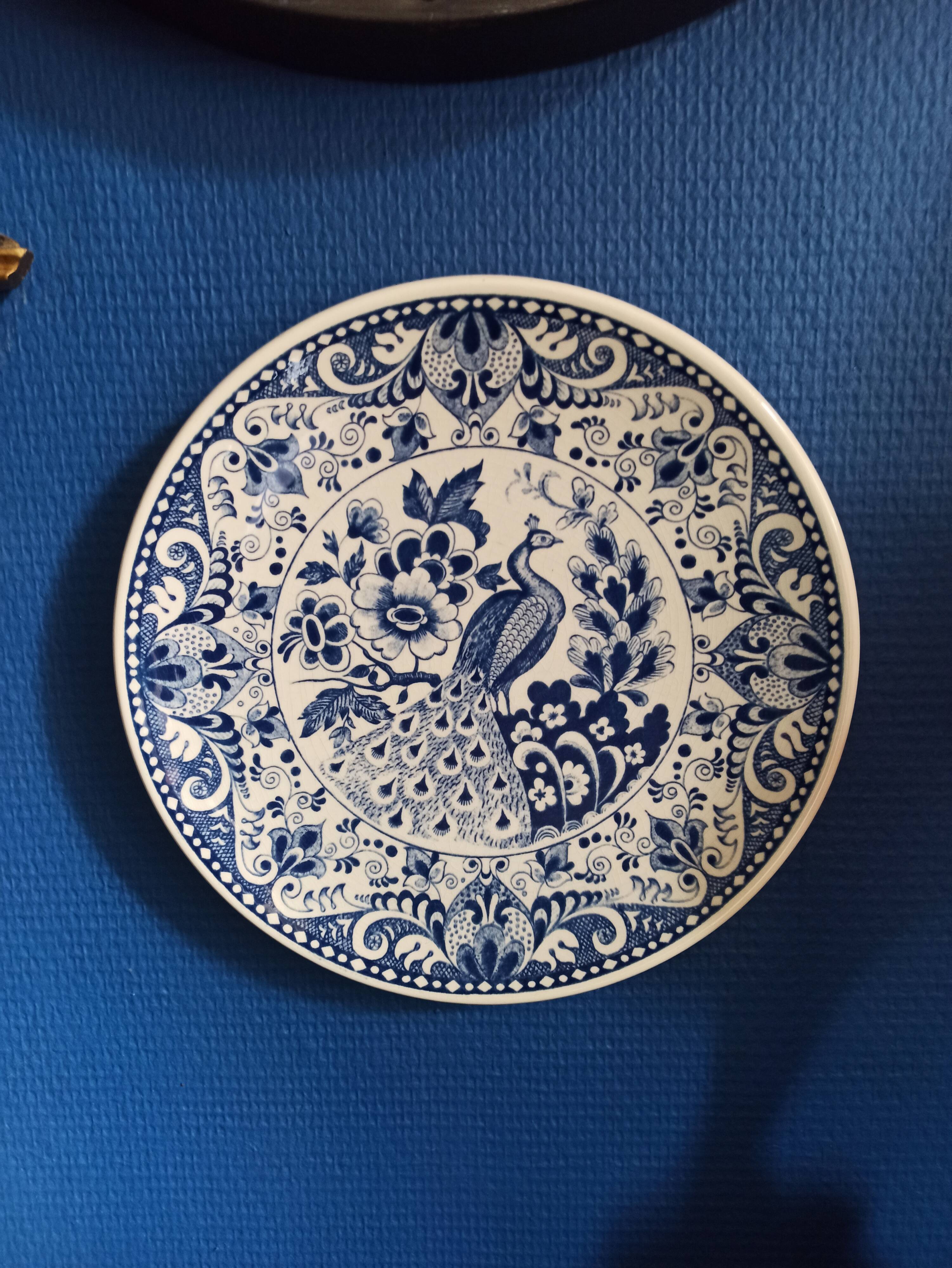 Majestic peacock plate from Dutch earthenware