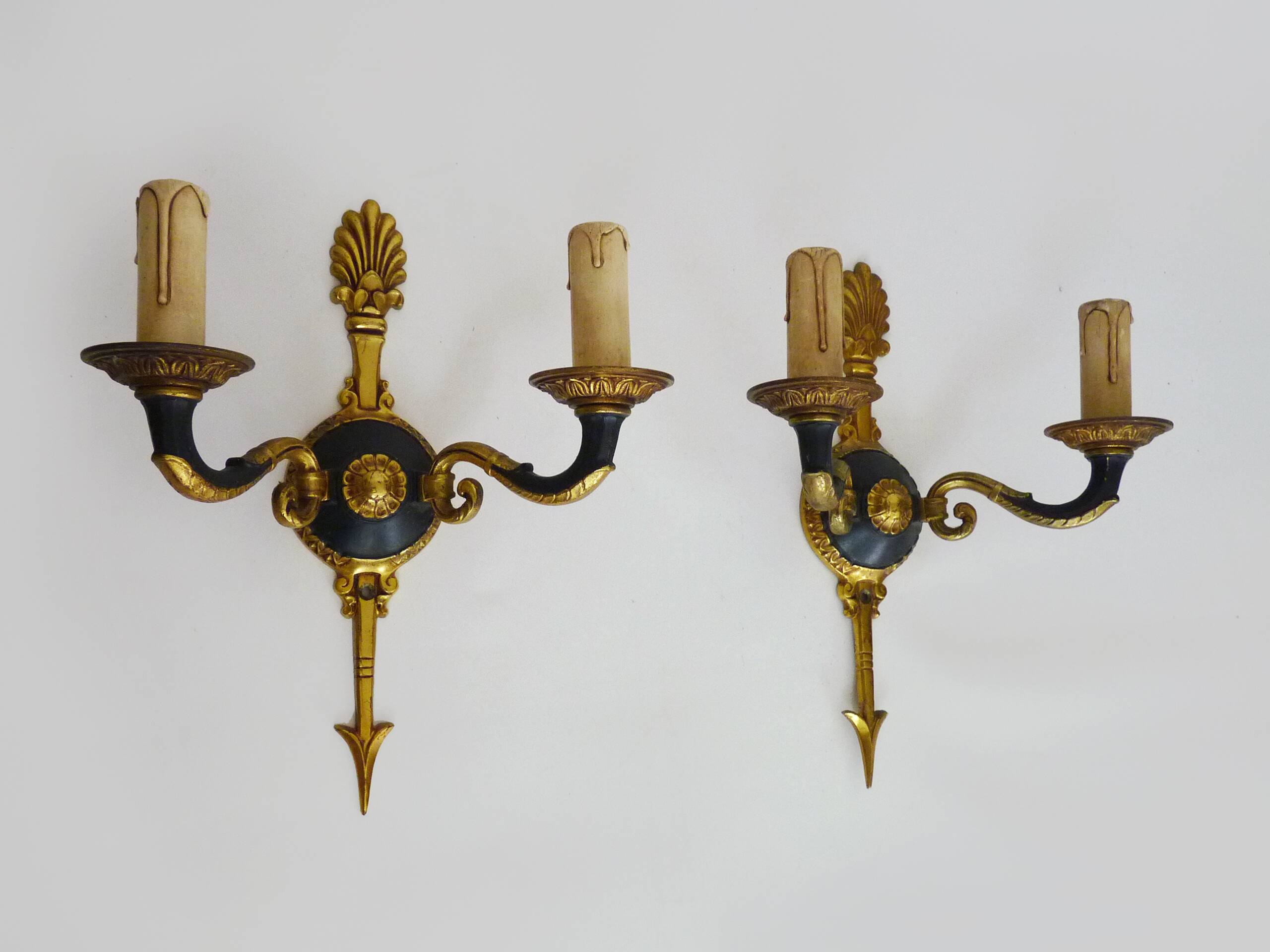 Pair of wall sconces in the Empire style with double lights in bronze.