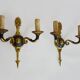 Pair of wall sconces in the Empire style with double lights in bronze.