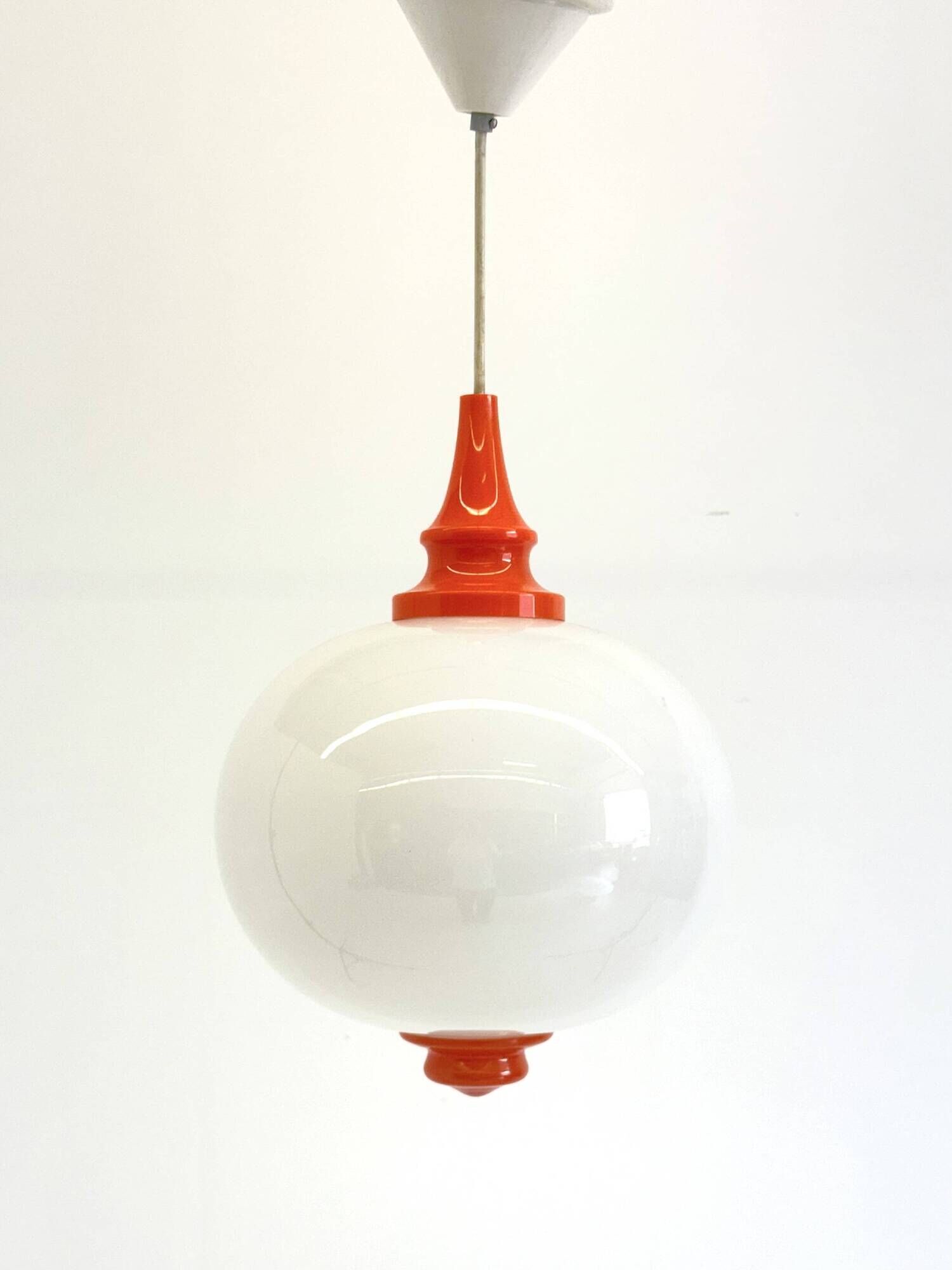 Space Age pendant lamp with milk glass ball and orange accents