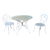 Part of a white lacquered wrought iron garden furniture set