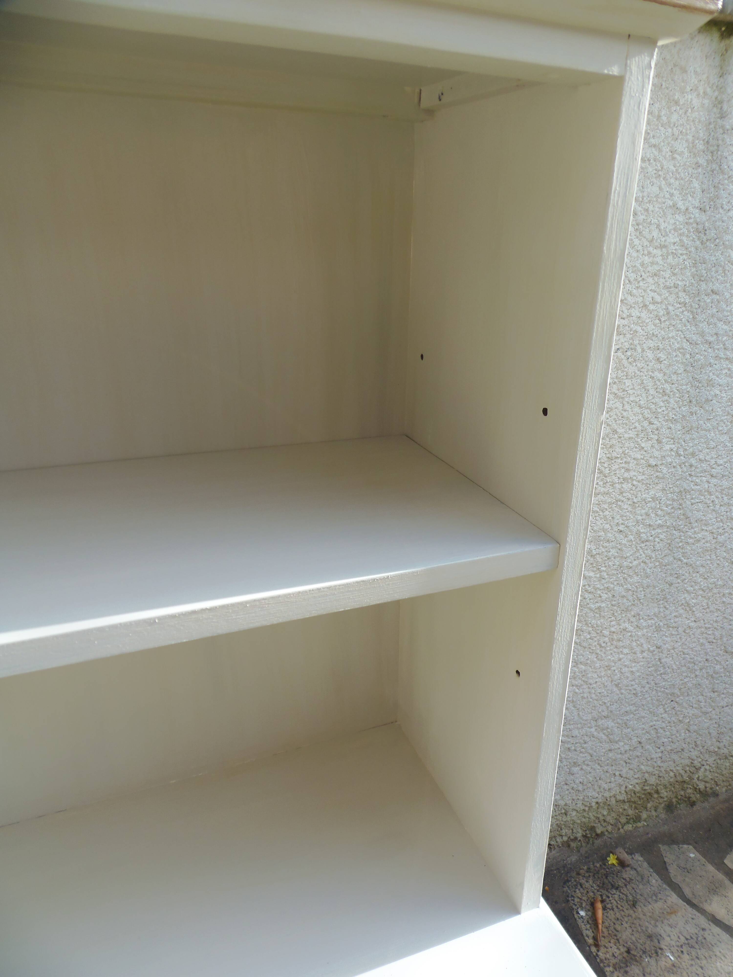 Vintage library enhanced in beige, wooden top.
