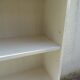 Vintage library enhanced in beige, wooden top.