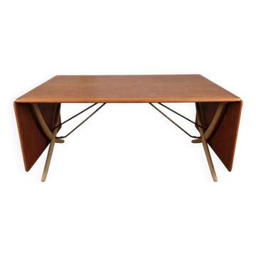 Rare teak and brass dining table, model AT 304 by Hans Wegner for Andreas Tuck, Denmark, 1950.