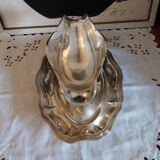 Sauce boat on a scalloped tray in silver metal