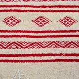 Traditional ethnic-patterned red and white carpet