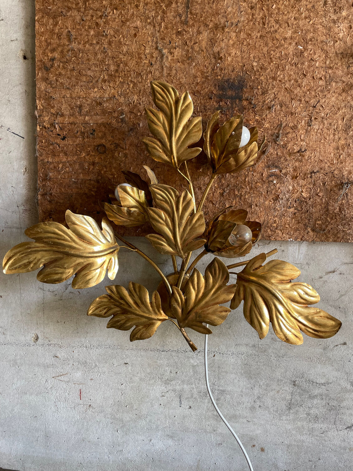 Golden wall lamp foliage