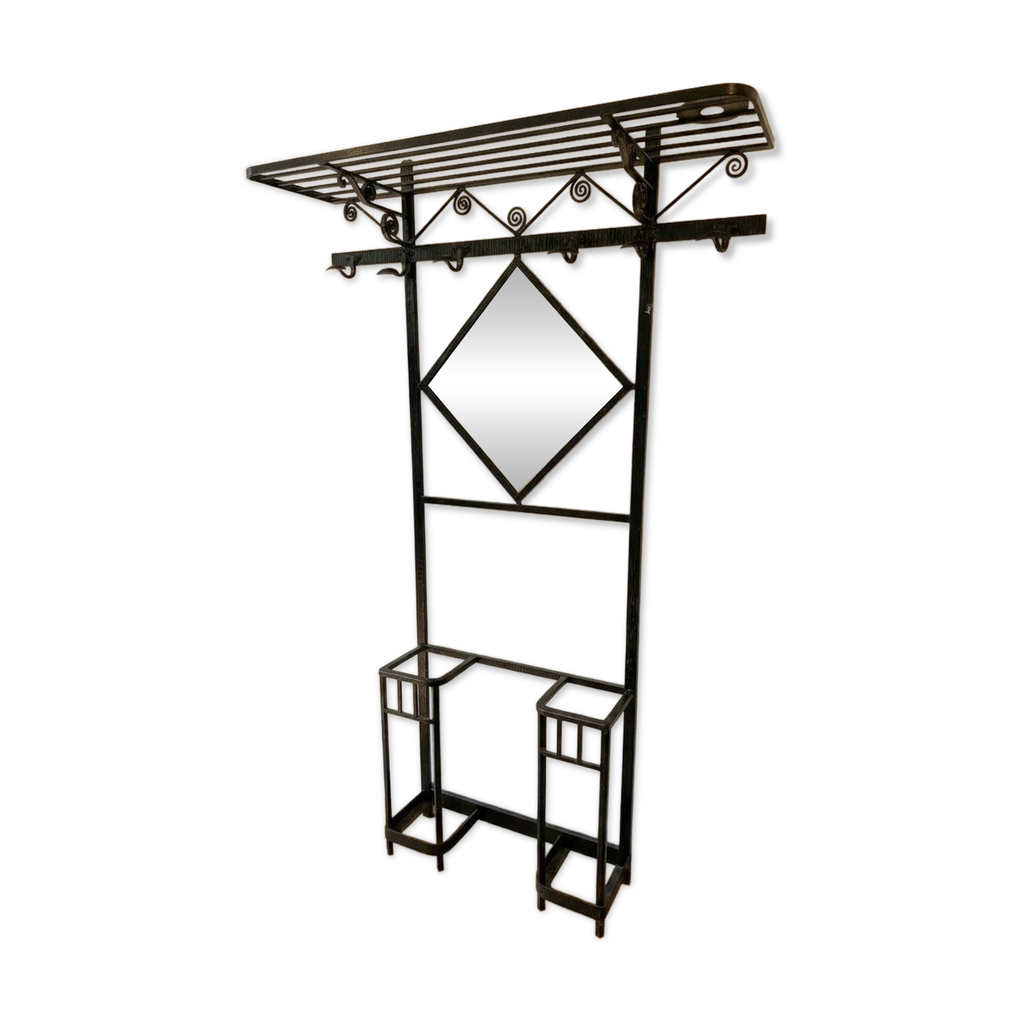 Antique black wrought iron coat rack with mirror.