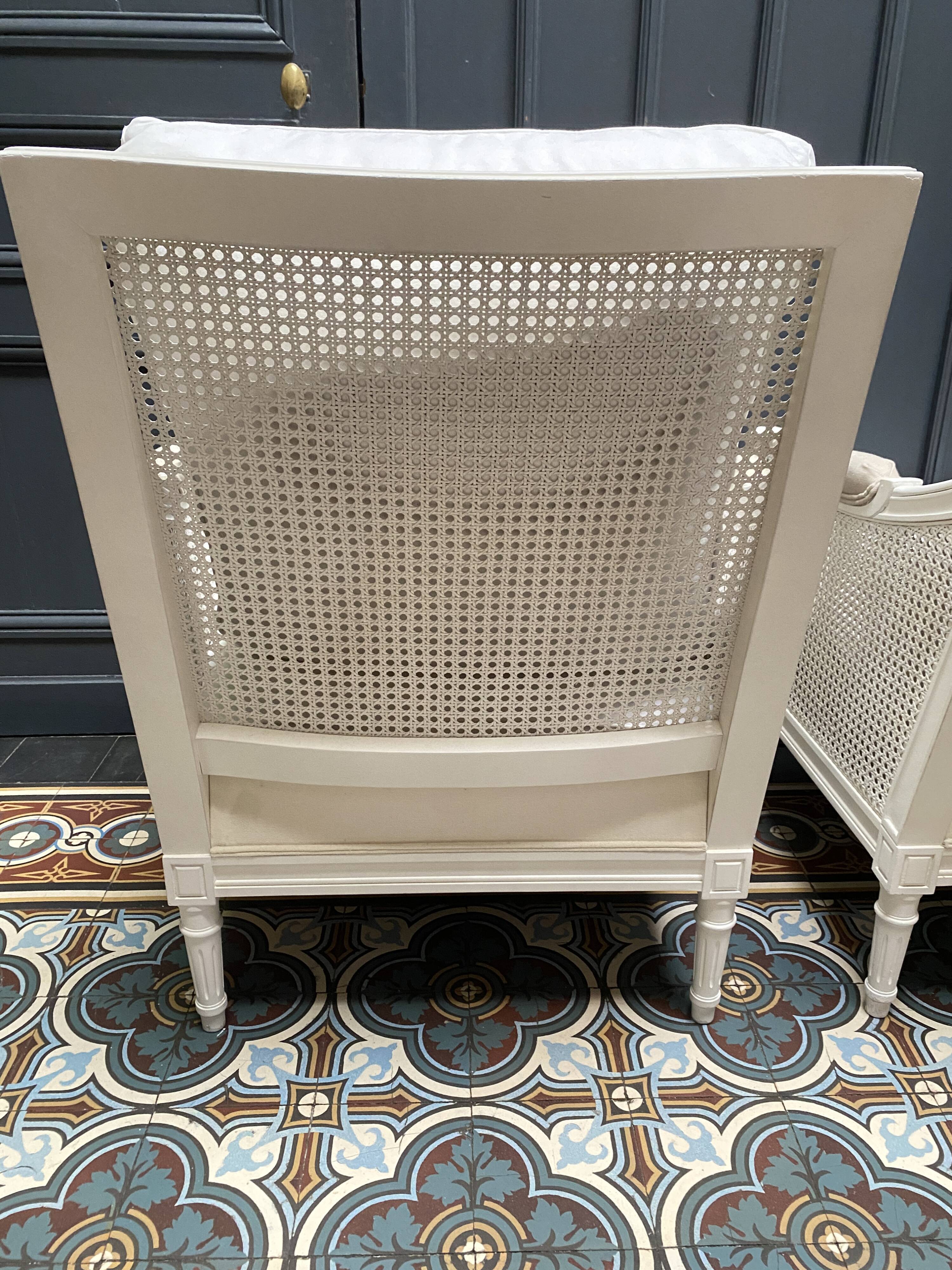 Pair of Louis XVI style caned Bergère armchairs