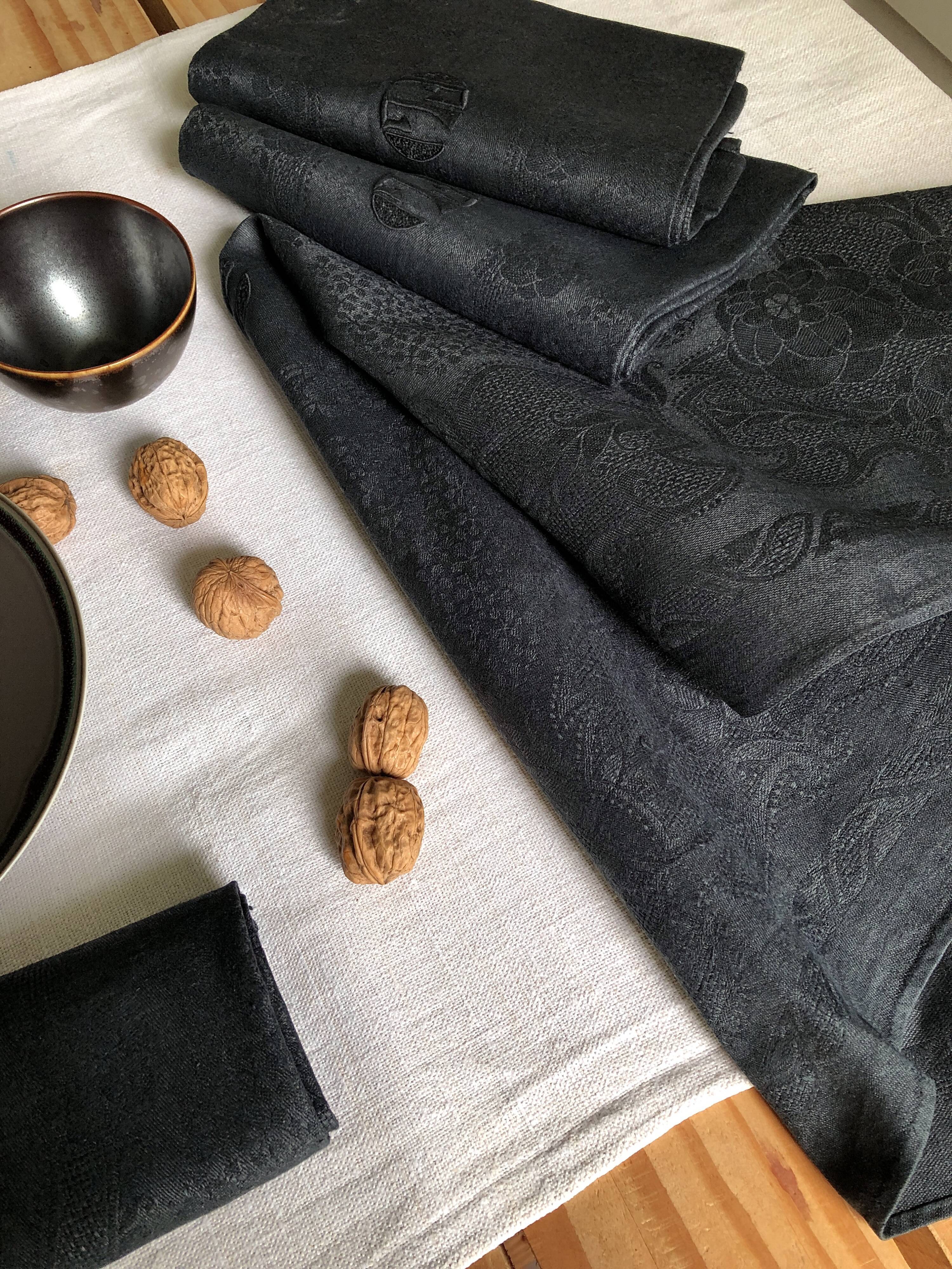 Set of four old damasked towels tinted black