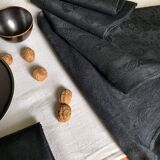 Set of four old damasked towels tinted black