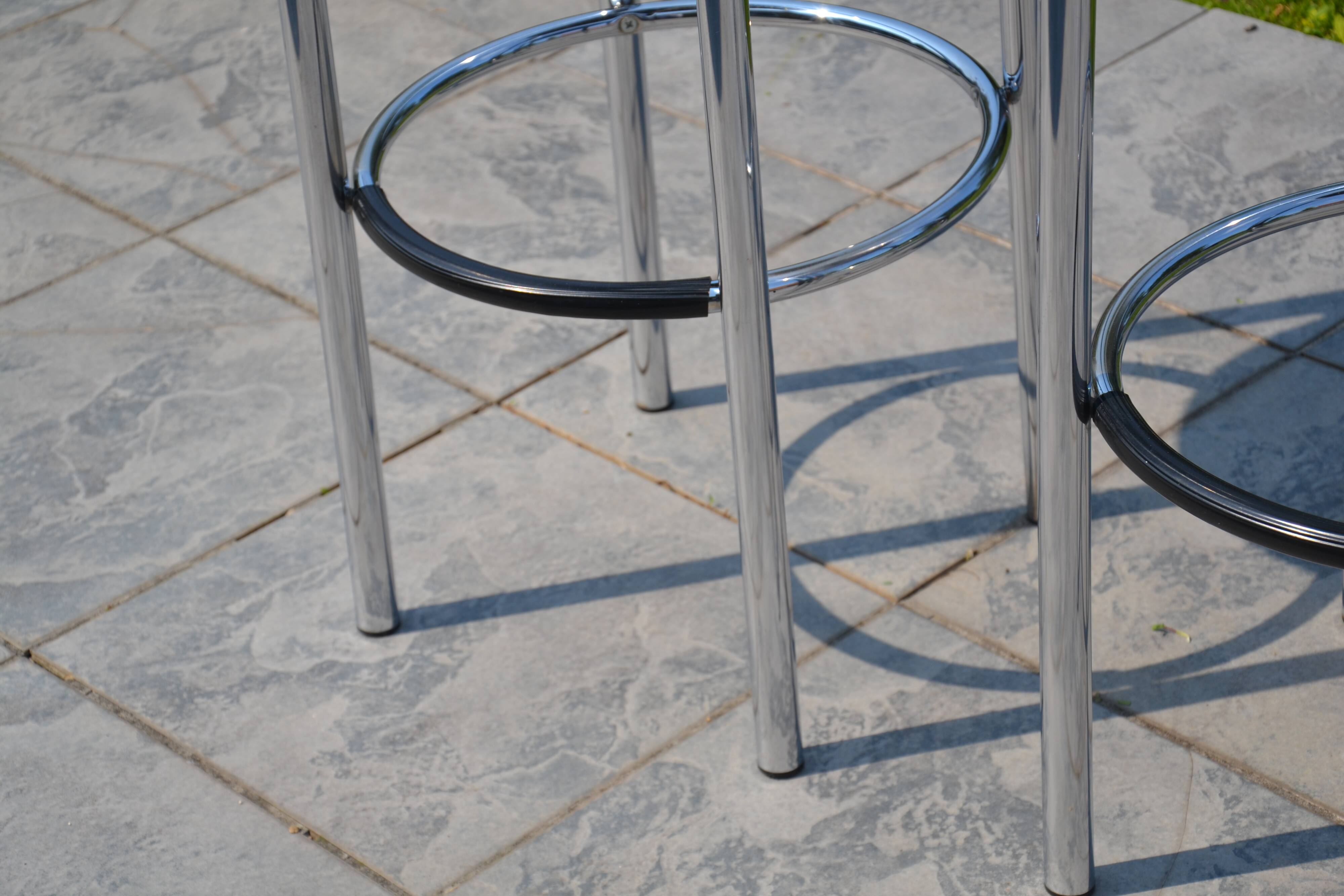 2 "Calligaris" bar stools with chrome metal and refurbished seats.