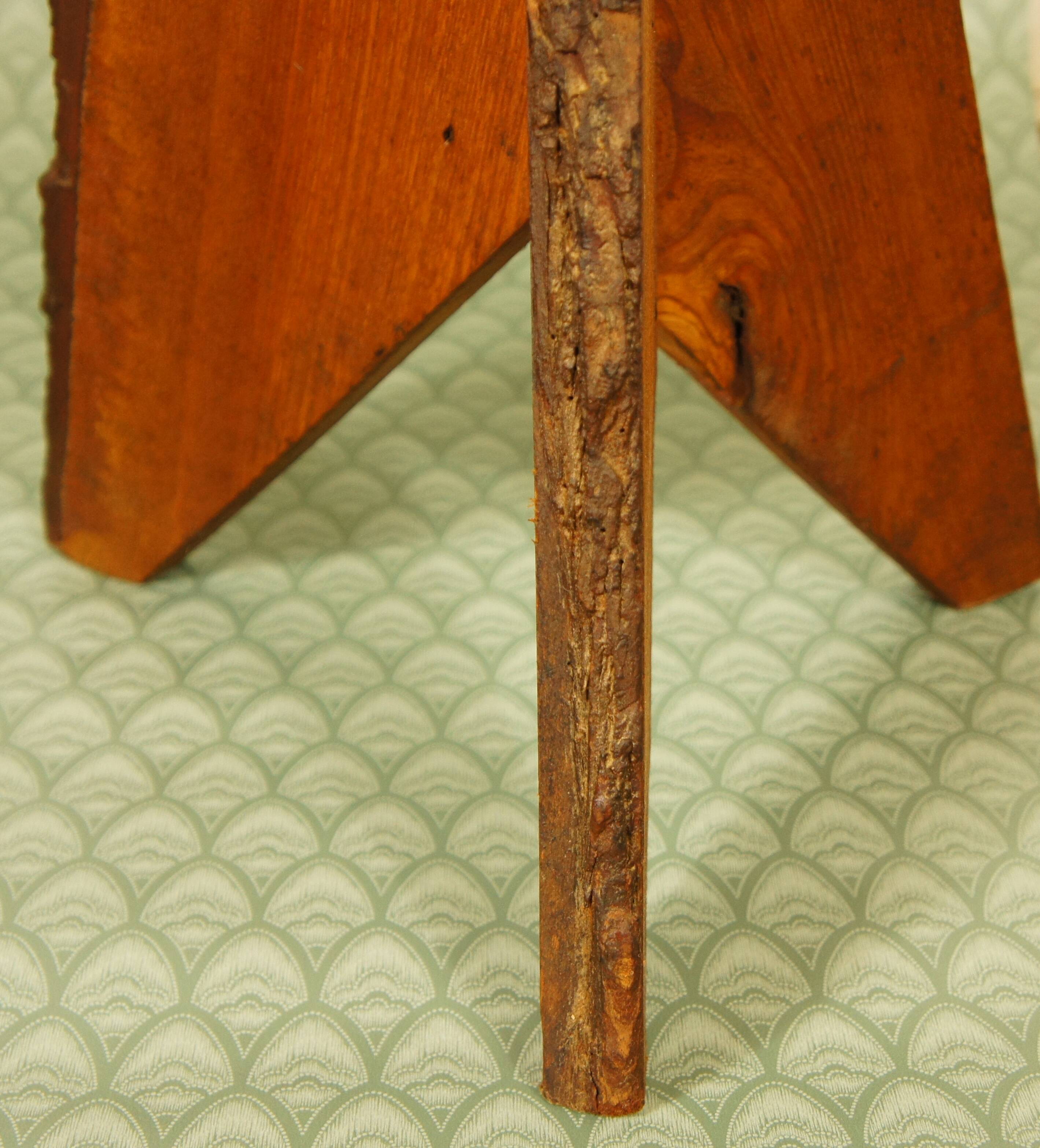 Brutalist stool tripod feet cross