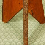 Brutalist stool tripod feet cross