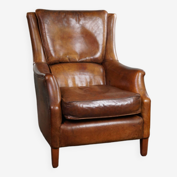 Fauteuil en cuir de mouton magnifiquement vieilli avec des couleurs époustouflantes et une assise très confortable