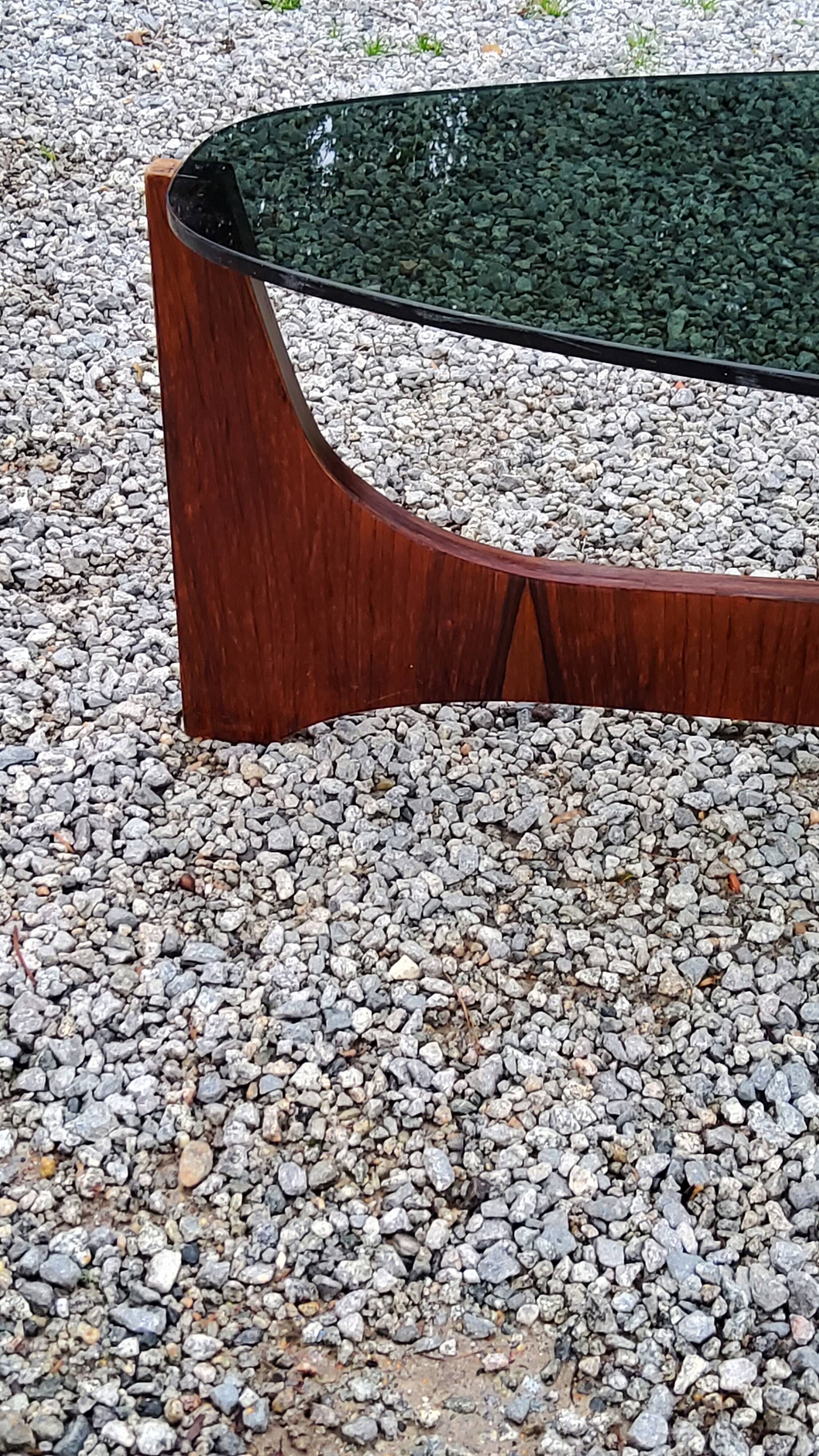 Designer coffee table by Hugues Poignant in rosewood and smoked glass from the 70s
