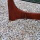Designer coffee table by Hugues Poignant in rosewood and smoked glass from the 70s