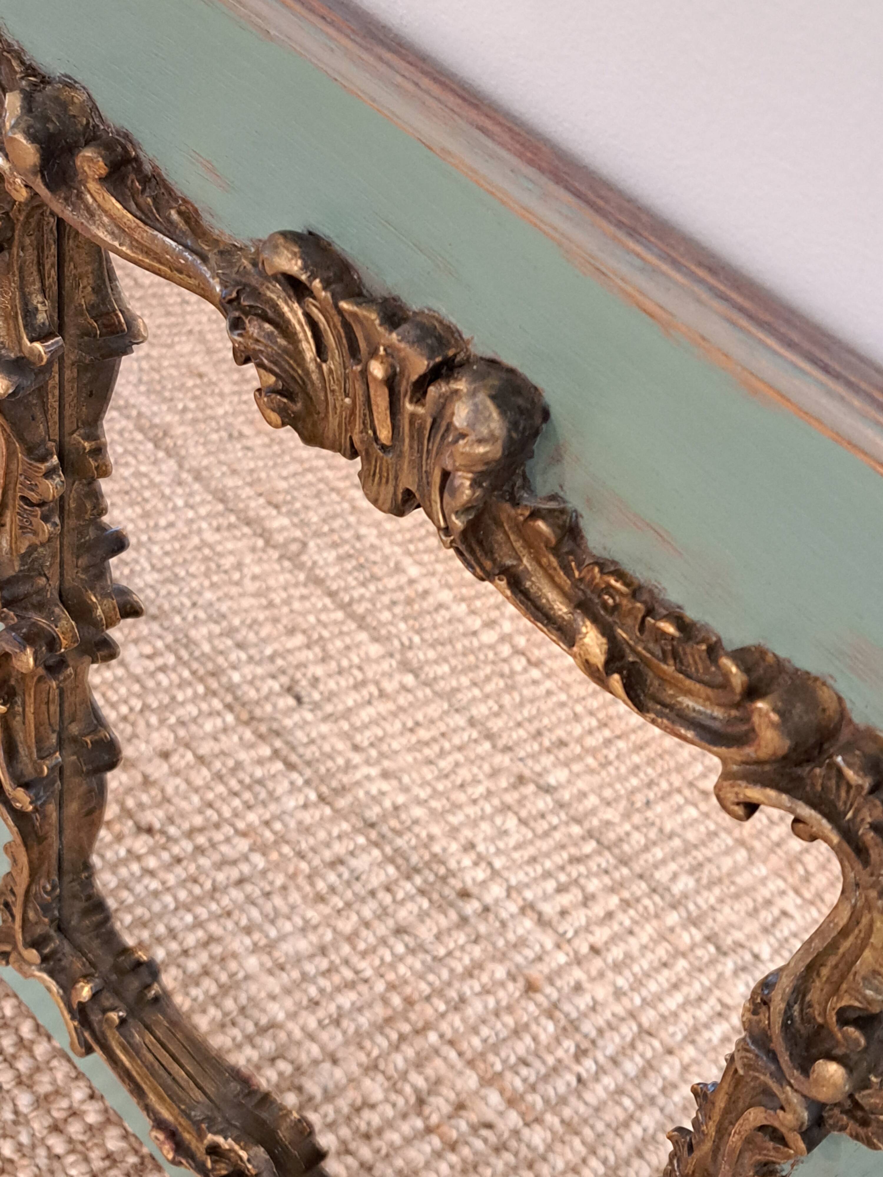 Antique Louis XV style mirror in wood and gilded stucco.