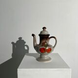 Vintage stoneware teapot with flower and fruit patterns