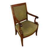 Empire armchair with dolphins in mahogany, armrests with sculpted consoles.