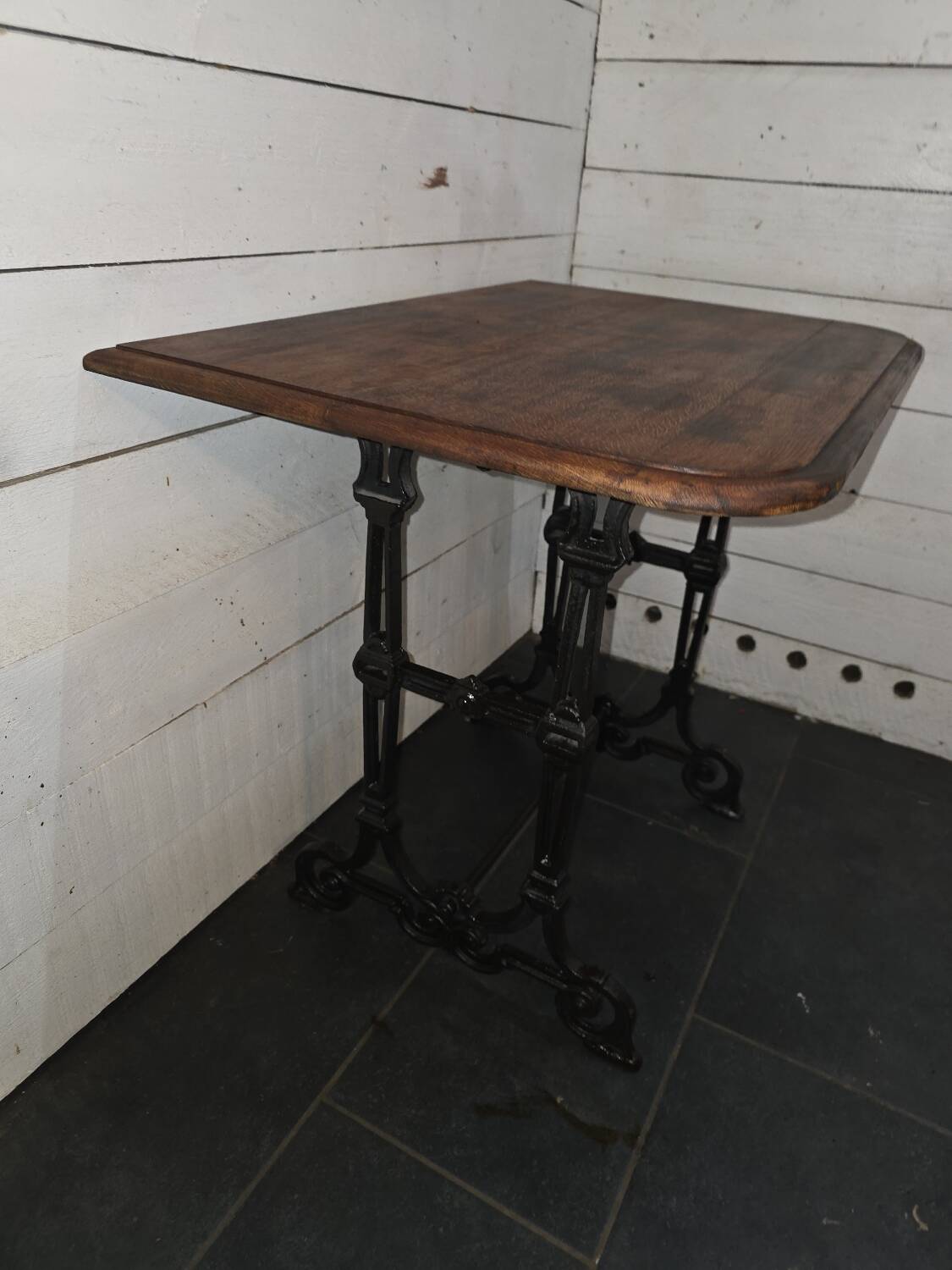 Bistro table with cast iron legs and oak top